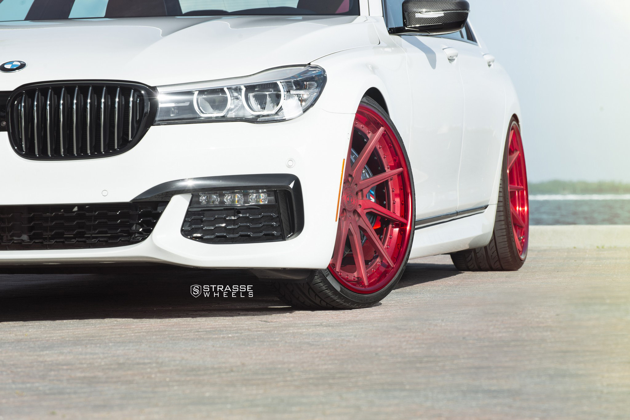 Alpine White BMW 7 Series Gets Red Strasse Wheels