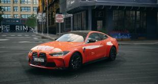 video-striking-bmw-m4-in-fire-orange-with-painted-stripes